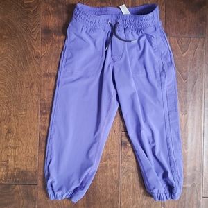 Ivivva lined purple joggers with pockets.